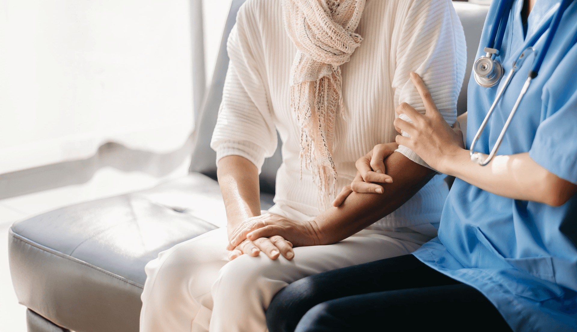 Doctor holding patient's  hand with compassion